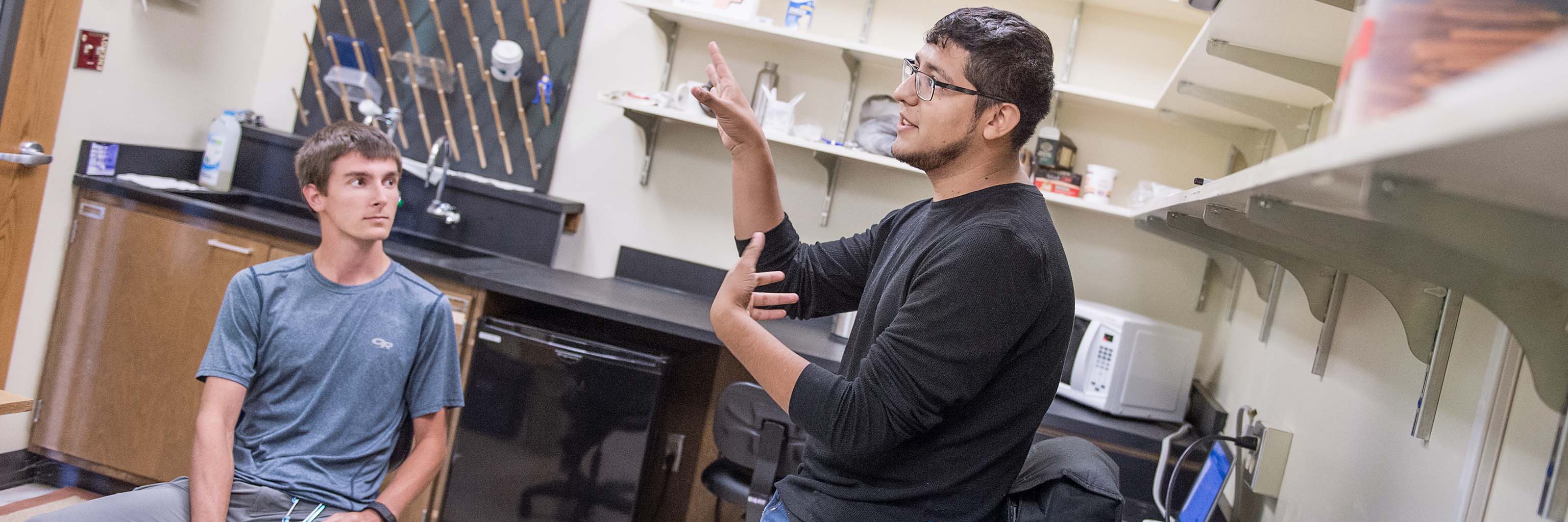 Students discussing in a lab