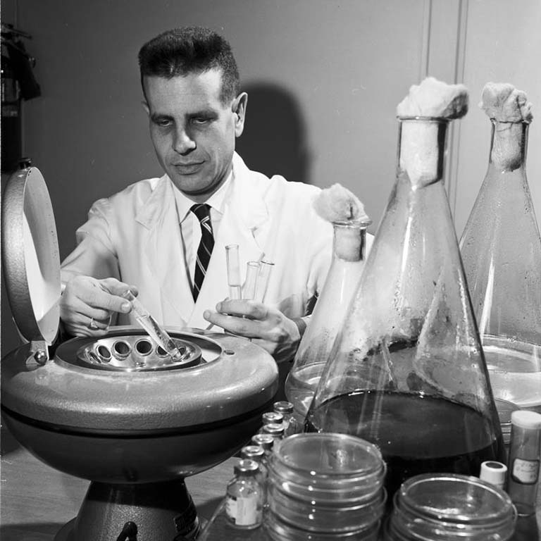 Professor Eugene Weinberg directing research on chelation (metal grabbing) by antibiotics in 1959.