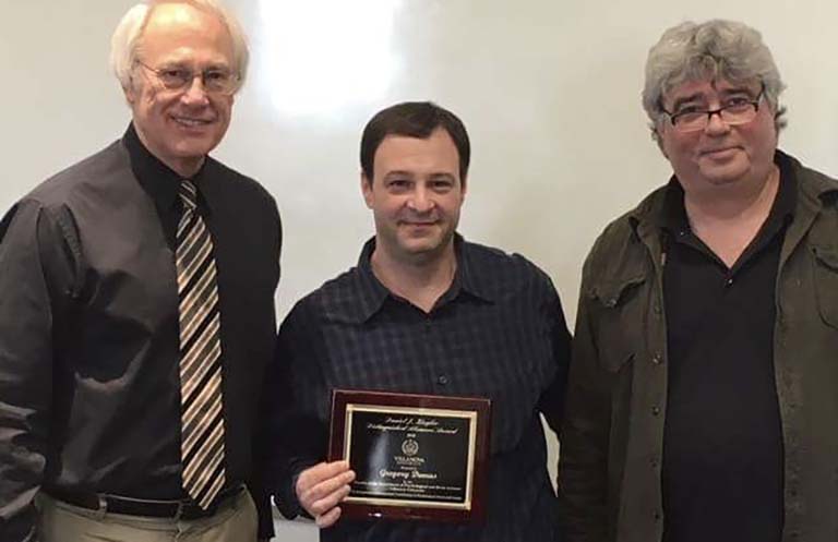 Villanova Professors Thomas Toppino (left) and Michael Brown (right) present Ziegler award to IU Professor Greg Demas (center) on March 23, 2018.