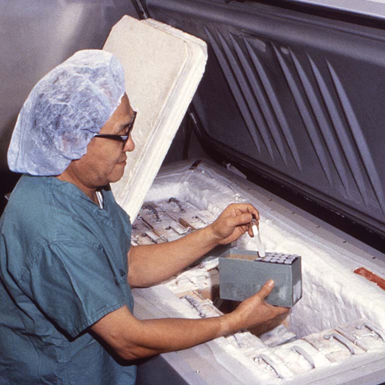 A lab worker pulls a vial containing smallpox virus from a freezer at a highly secured lab at the CDC in 1980.