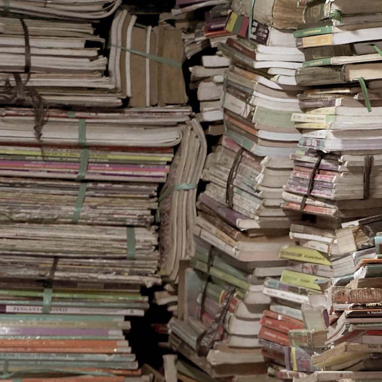 Stacks of journals and books.