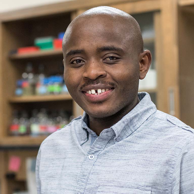 Gabriel Muhire Gihana poses in the lab.