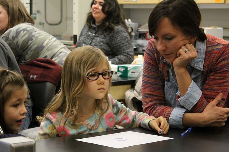 To observe trail-following behavior in termites during Armin Moczek’s 'Introducing the scientific method' module, a student releases a termite onto the paper on which she’s drawn a circle.