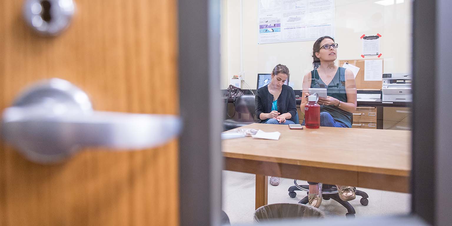 students taking notes in a classroom